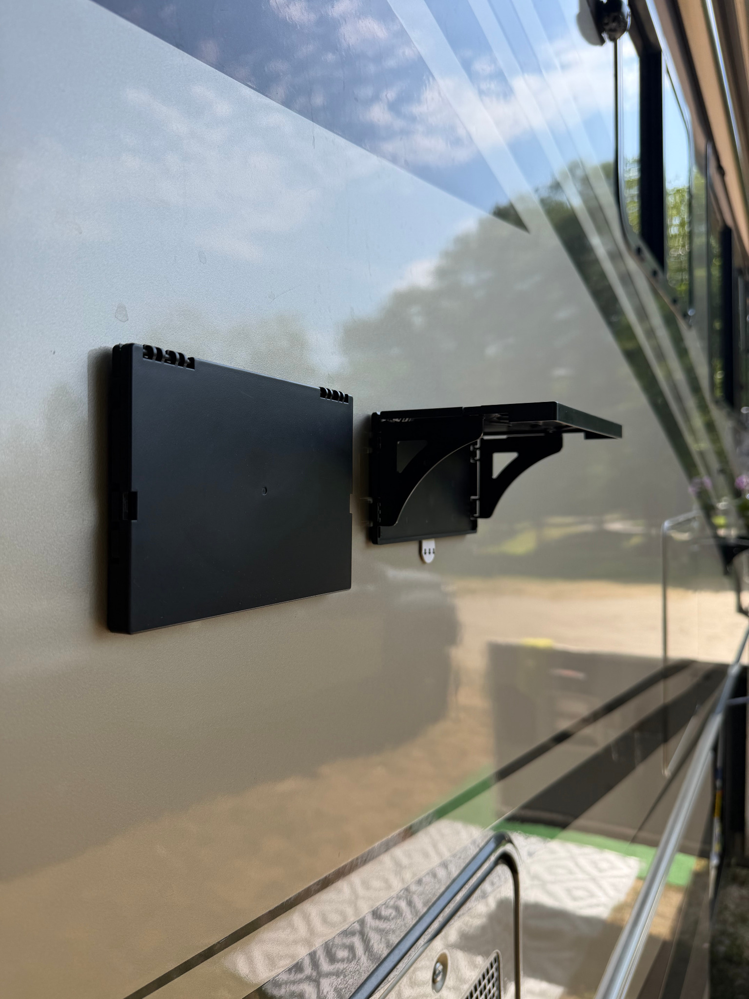 Two Pocket Shelves on an RV, one open and one folded